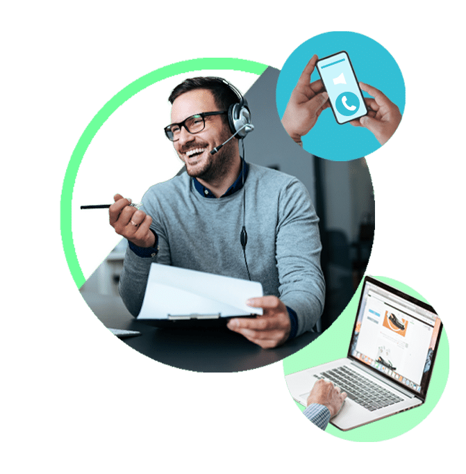 Young rep smiling while on the phone next to someone holding a phone and working on a laptop